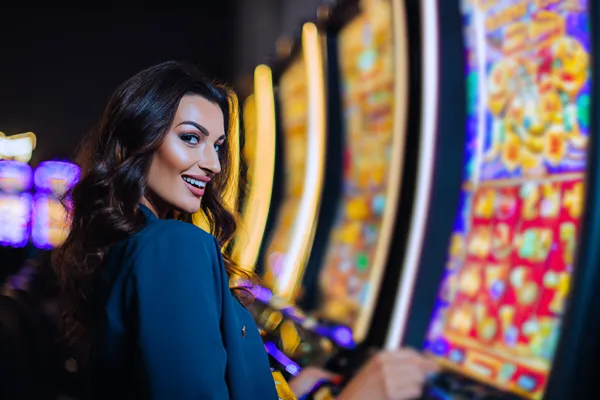A close-up shot of golden coins falling around a spinning roulette wheel, representing immersive casino action at JETA90.